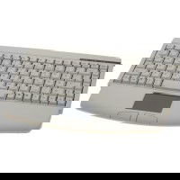 Restlager: Standard ministastatur i beige, med touchpad til PS2